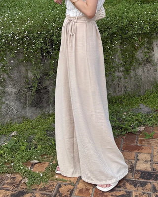 Two-button strap slacks
