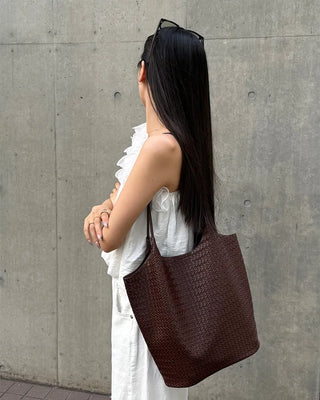 Asymmetrical ruffled sleeveless blouse