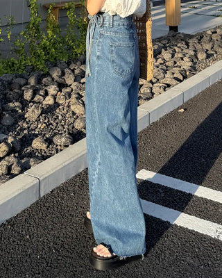 High-waisted denim pants with button strings
