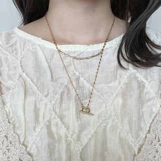 Round motif toggle clasp necklace