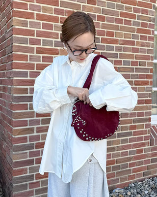 Studded suede shoulder bag