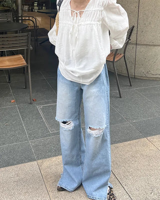 Distressed wide-fit denim pants