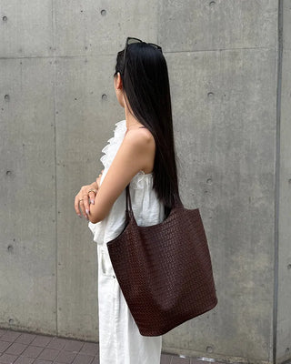 Asymmetrical ruffled sleeveless blouse