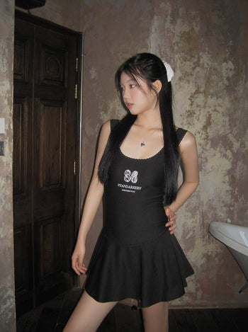 Short black suspender dress