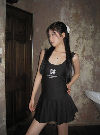 Short black suspender dress
