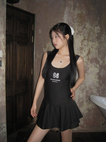 Short black suspender dress