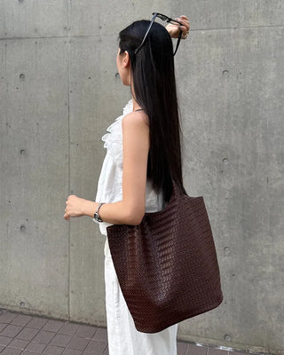 Asymmetrical ruffled sleeveless blouse
