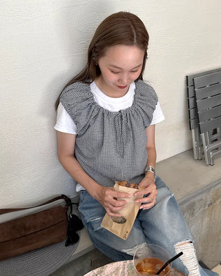 String sleeveless blouse