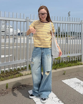 Distressed wide-fit denim pants