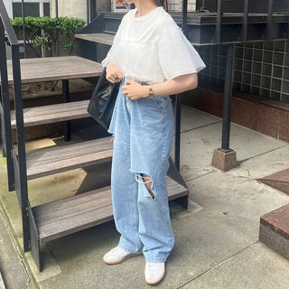 Distressed straight denim pants