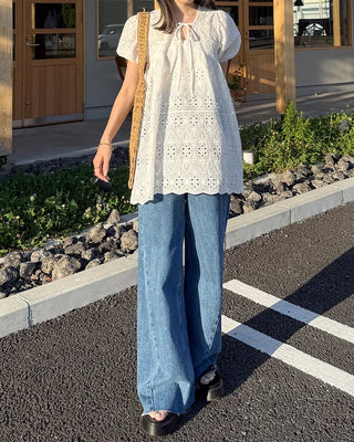 High-waisted denim pants with button strings
