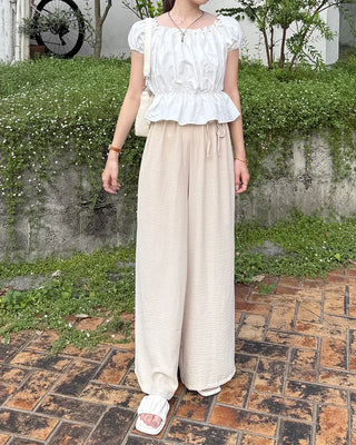 Two-button strap slacks