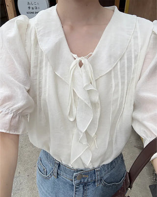 Pintuck ruffle bow tie blouse
