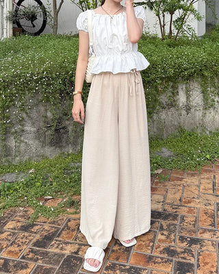 Two-button strap slacks