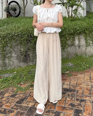 Two-button strap slacks