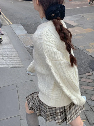 Loose-fit wool twist cable knit sweater