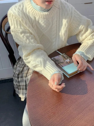 Loose-fit wool twist cable knit sweater