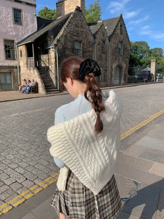 Loose-fit wool twist cable knit sweater