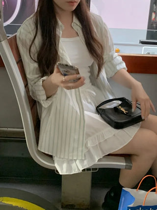 Loose-fit cotton striped shirt (2c)