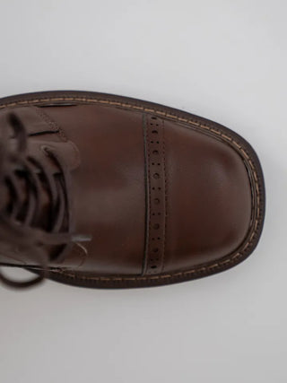 Cogging buckle long boots
