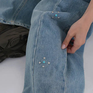 wide denim jeans with side studs