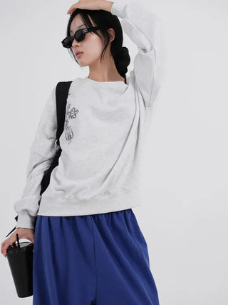 Cora Saint Graphic Off-Shoulder Sweatshirt