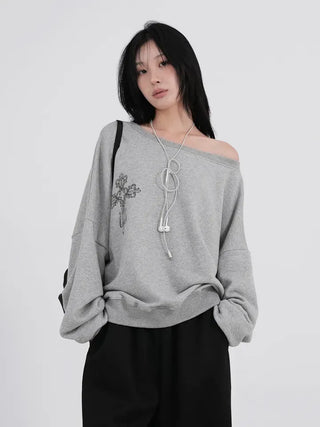 Cora Saint Graphic Off-Shoulder Sweatshirt