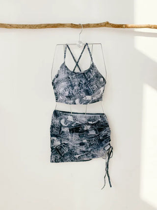 Denim printed piece bikini with shirring and body-covering swimsuit for resort vacation and water park.