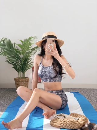 Denim printed piece bikini with shirring and body-covering swimsuit for resort vacation and water park.