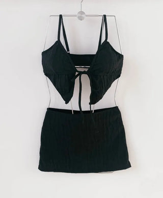 Black piece bikini with skirt and optional cap. piece swimsuit.
