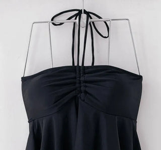 Low-rise halterneck black swimsuit bikini swimwear holiday look shirring and resort look