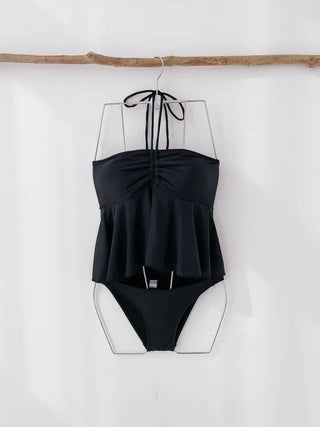 Low-rise halterneck black swimsuit bikini swimwear holiday look shirring and resort look