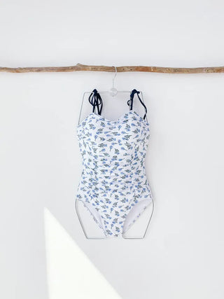 Flower ribbon monokini shirring cap-added swimsuit with no exposed belly fat coverage
