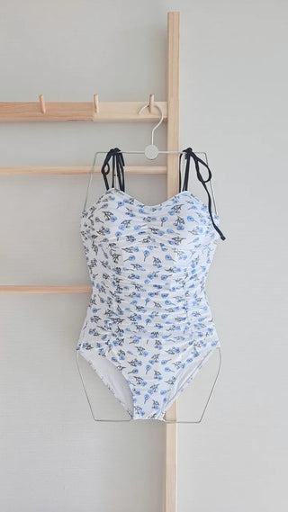 Flower ribbon monokini shirring cap-added swimsuit with no exposed belly fat coverage
