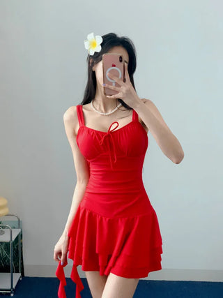 One-piece swimsuit with red frills ribbon and red beach vacation swimsuit