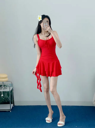 One-piece swimsuit with red frills ribbon and red beach vacation swimsuit