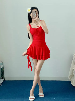 One-piece swimsuit with red frills ribbon and red beach vacation swimsuit
