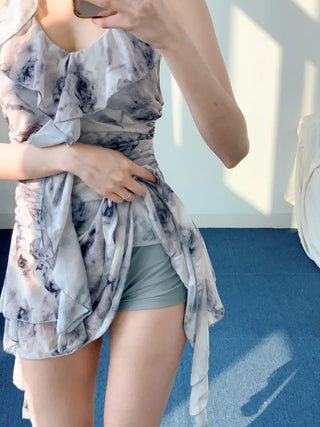 Gray halter neck frill one-piece swimsuit with floral pattern and underpants for a resort look and vacation look.