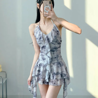 Gray halter neck frill one-piece swimsuit with floral pattern and underpants for a resort look and vacation look.