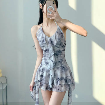 Gray halter neck frill one-piece swimsuit with floral pattern and underpants for a resort look and vacation look.