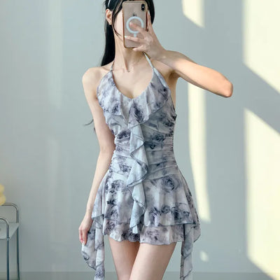 Gray halter neck frill one-piece swimsuit with floral pattern and underpants for a resort look and vacation look.