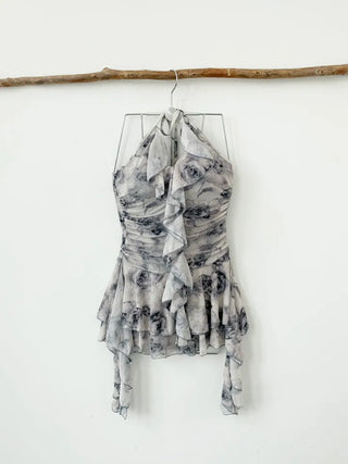 Gray halter neck frill one-piece swimsuit with floral pattern and underpants for a resort look and vacation look.