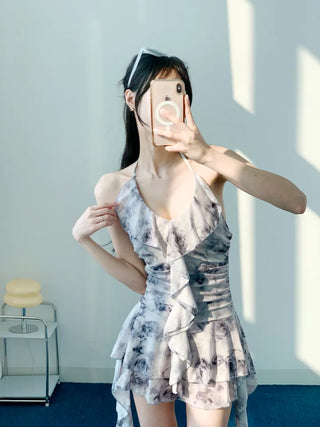Gray halter neck frill one-piece swimsuit with floral pattern and underpants for a resort look and vacation look.