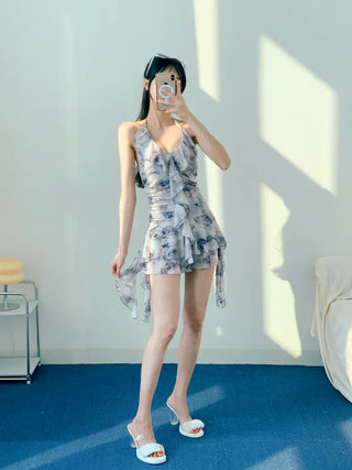 Gray halter neck frill one-piece swimsuit with floral pattern and underpants for a resort look and vacation look.