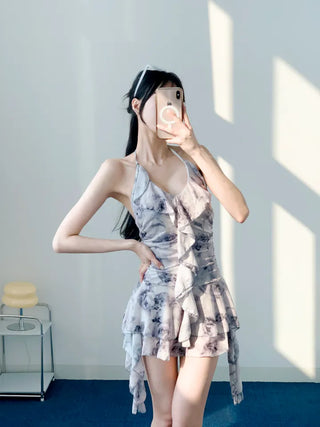 Gray halter neck frill one-piece swimsuit with floral pattern and underpants for a resort look and vacation look.