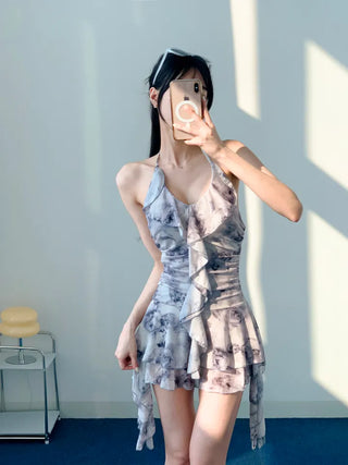 Gray halter neck frill one-piece swimsuit with floral pattern and underpants for a resort look and vacation look.
