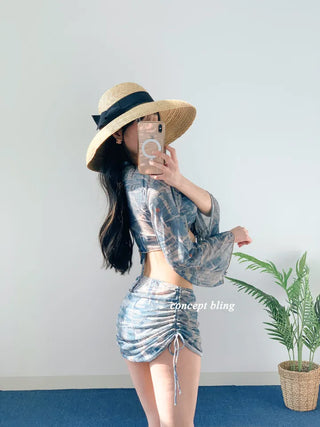 Vintage denim piece bikini with cardigan cover-up skirt and string body-covering tummy-covering swimsuit