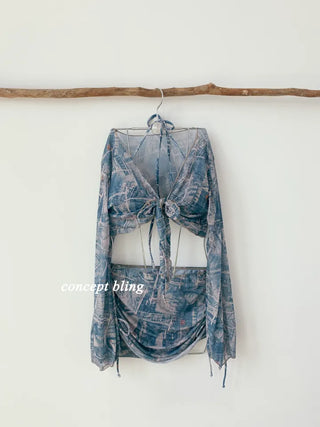 Vintage denim piece bikini with cardigan cover-up skirt and string body-covering tummy-covering swimsuit