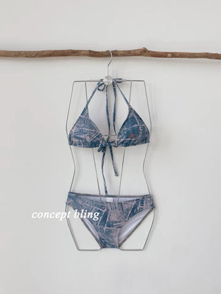 Vintage denim piece bikini with cardigan cover-up skirt and string body-covering tummy-covering swimsuit