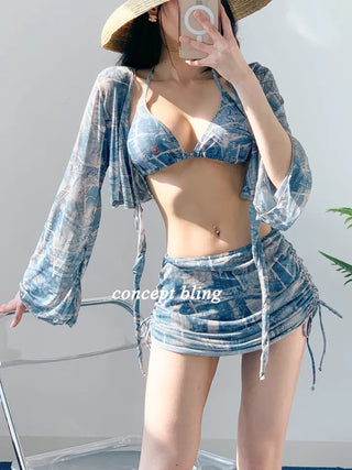 Vintage denim piece bikini with cardigan cover-up skirt and string body-covering tummy-covering swimsuit